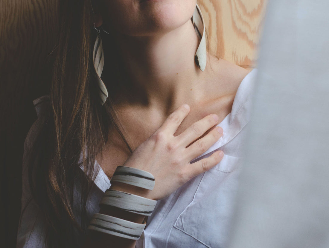 Lightweight wooden earrings "Twist". White Makassar and Anigre